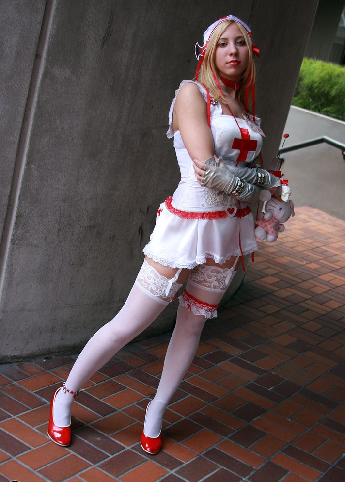 Blonde Nurse wearing White Opaque Stockings and White Short Dress